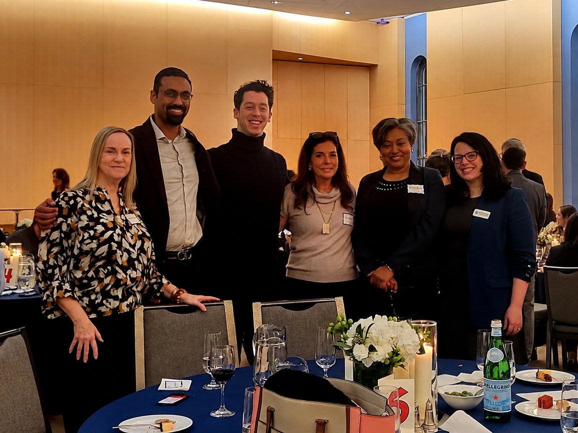 Nirmala Ramlall with guests at a community dinner